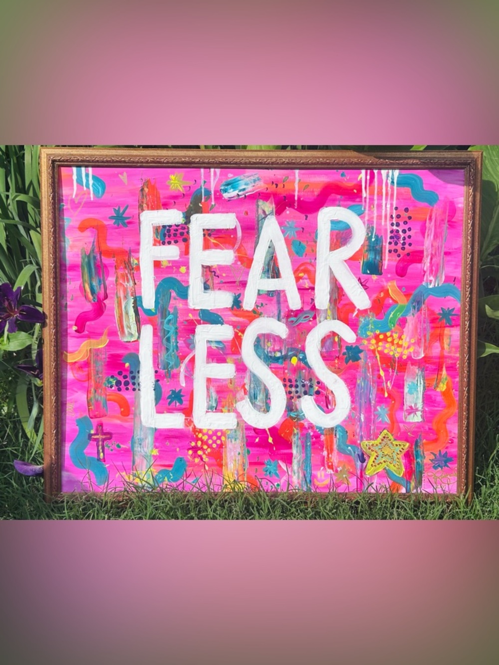 Hand-painted abstract canvas with bold, vibrant colors “Fear Less.”